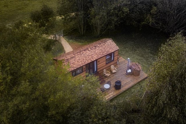 A whimsical woodland cabin for two, complete with hot tub and privately nestled in an East Sussex Area of Outstanding Natural Beauty. Inside awaits an elegant space designed for comfort, with plenty of quirky additions that include upcycled lamps, and stag antlers direct from Downash Wood.