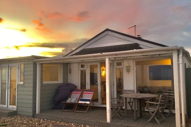 This dog-friendly retreat is formed around an authentic Victorian railway carriage and set directly on the beach.