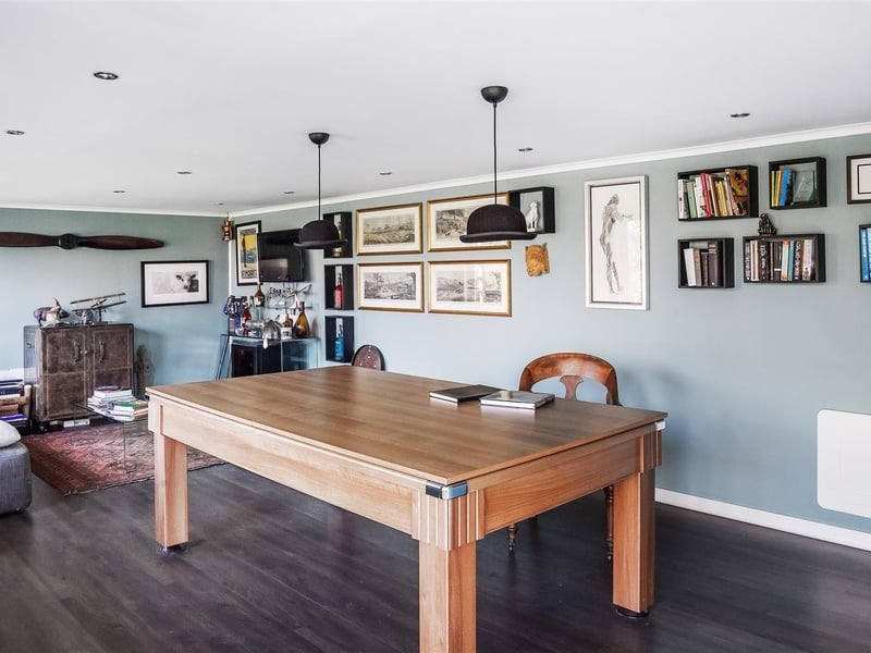 A beautifully presented family home providing adaptable accommodation, with the benefit of a home office and triple garage with studio over. Price: £1,950,000.