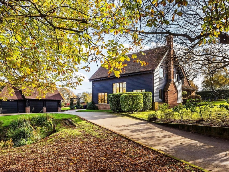 A beautifully presented family home providing adaptable accommodation, with the benefit of a home office and triple garage with studio over. Price: £1,950,000.