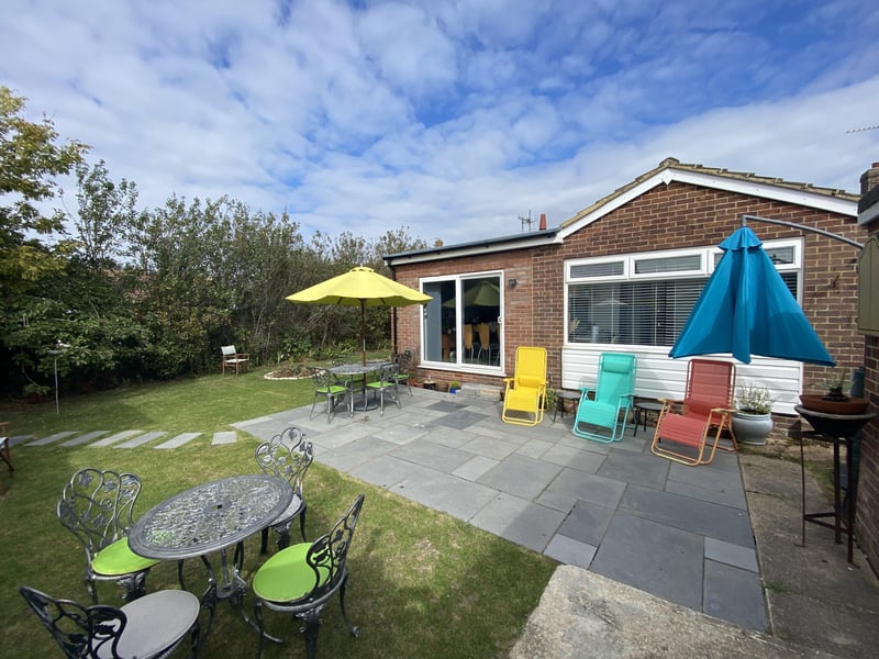 Extended and modernised two bedroom detached bungalow with a superb garden room. Price: £350,000.