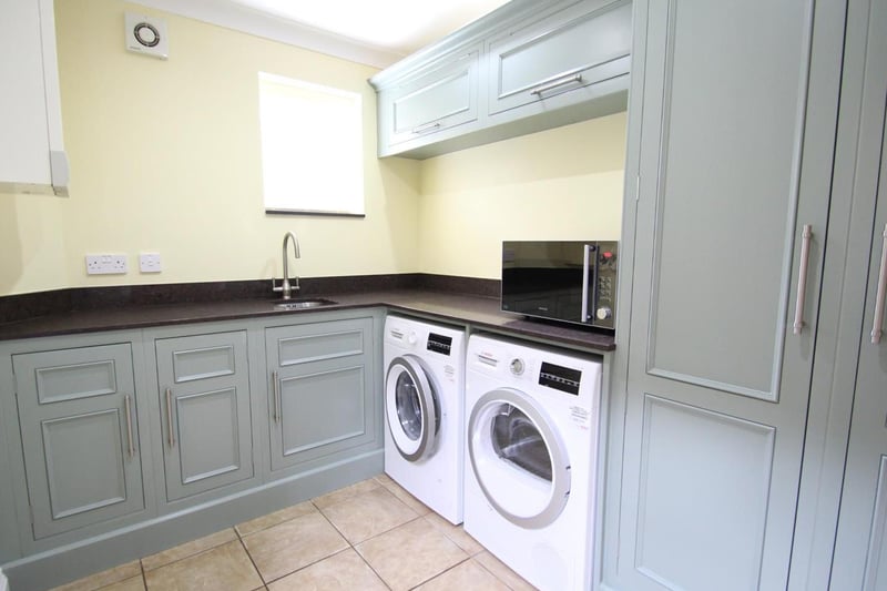The Utility Room has a range of matching kitchen units to floor and wall levels and a larder cupboard. Quartz work tops and an under mounted sink. Space for a washing machine and tumble dryer. Ceramic tile floor, gas and heating boiler and a recently installed composite door to the side and window to the front.