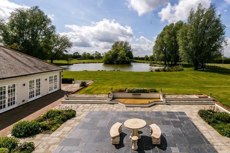 The house is set in 12 acres of land and has its own lake