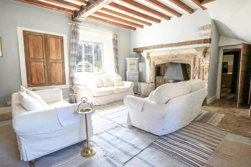 A living room inside the grade II listed property Abbey Lodge in Farthinghoe (photo from Rightmove)