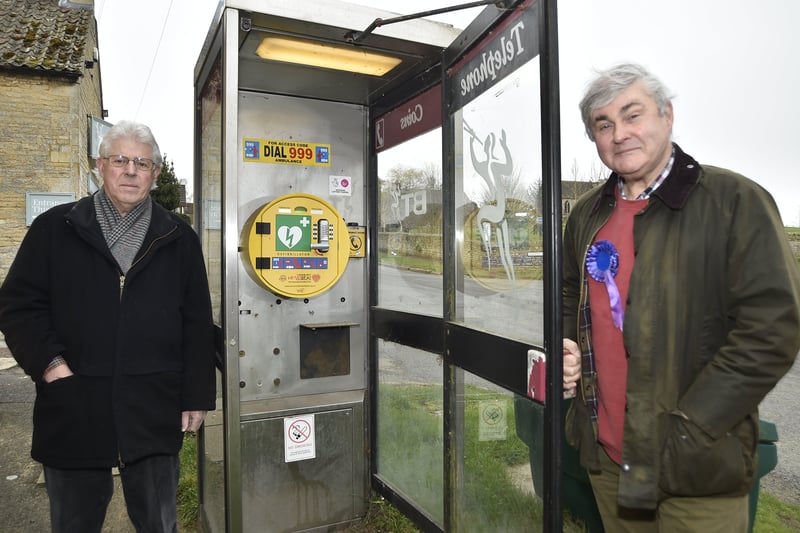 Phonebox at Ufford used to house a  defibrillator with Cllr David Over and Chairman of the Parish Council Keith Lievesley EMN-210317-114924009