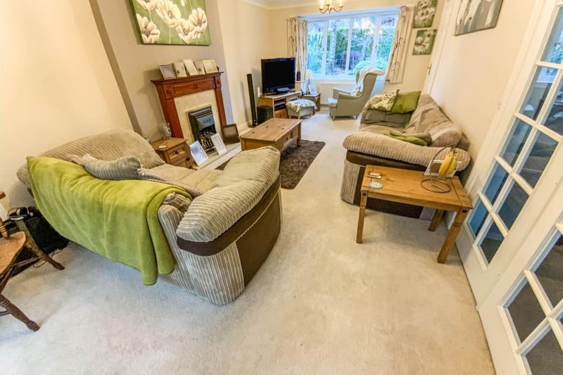 The living room is dual aspect with a bay window to the front and double doors to the conservatory.
