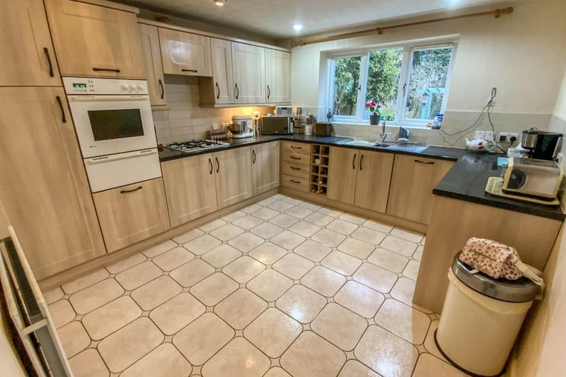 Kitchen/breakfast room is fitted with contrasting units and granite effect work surfaces.