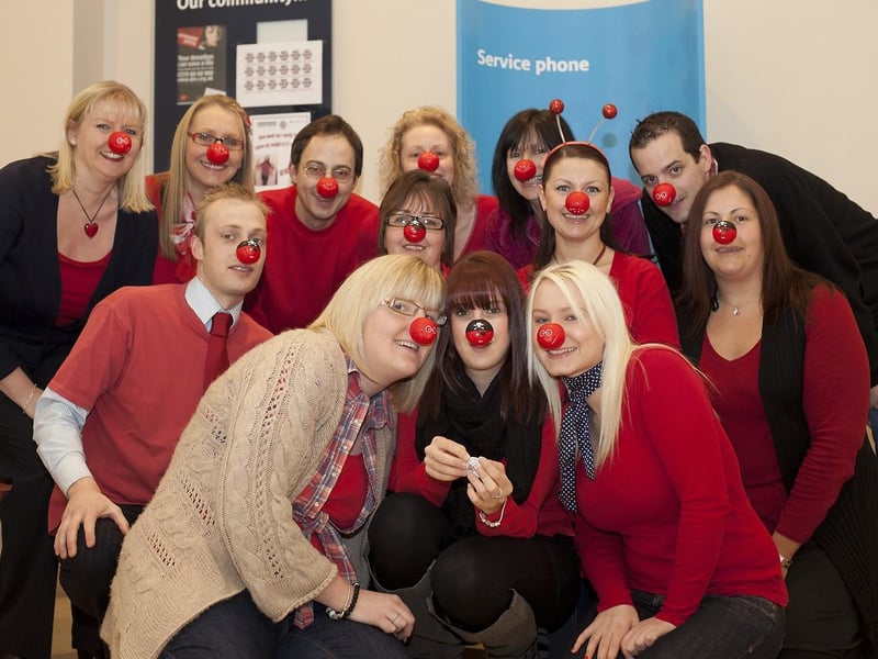 Staff at Barclays Bank Skegness, dressed in red.