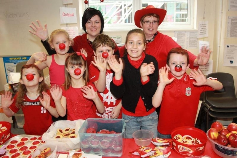 Pupils at the Magdalen School Wainfleet, selling red food and dressed in red.