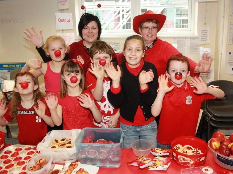 Pupils at the Magdalen School Wainfleet, selling red food and dressed in red.