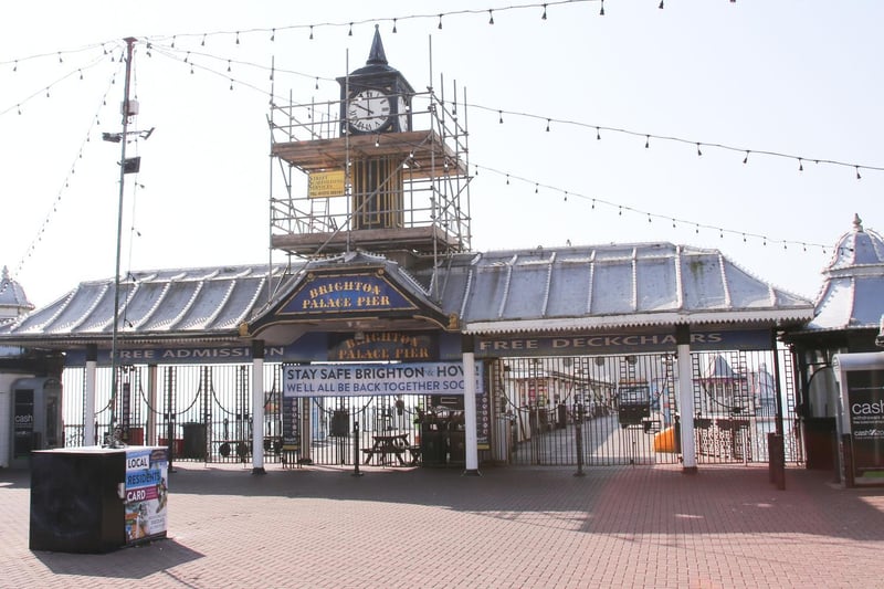 The closed Palace Pier with a sign on the gates which says, Stay safe Brighton & Hove: We'll all be back together soon