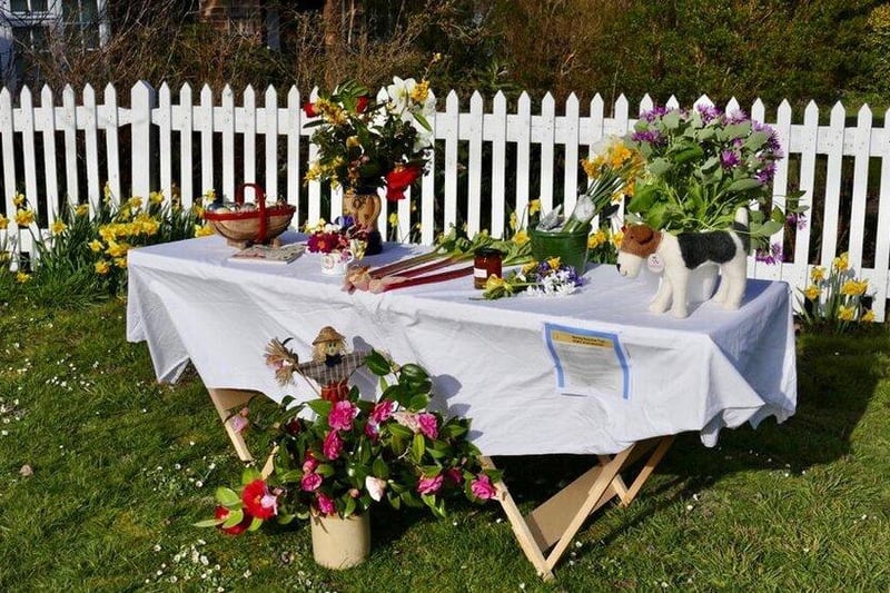 Both fresh flowers and home-grown produce were displayed outside this home