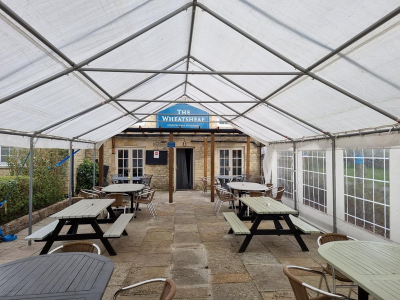 The Wheatsheaf in Titchmarsh has a takeaway service available with menus published weekly. This country pub is dog friendly, has a large car park and a huge garden and patio area covered by a marquee.