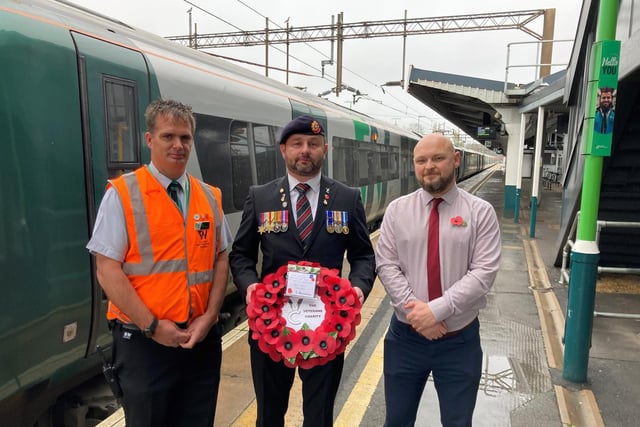 Iraq veteran Dean Griffin with London Northwestern Railway staff members Edd Morris (left) and Daniel Dalmonego (right) at Northampton Railway Station.