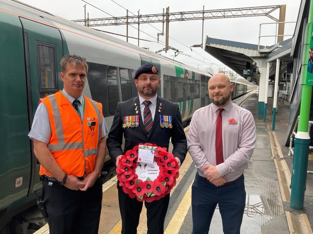 Iraq veteran Dean Griffin with London Northwestern Railway staff members Edd Morris (left) and Daniel Dalmonego (right) at Northampton Railway Station.