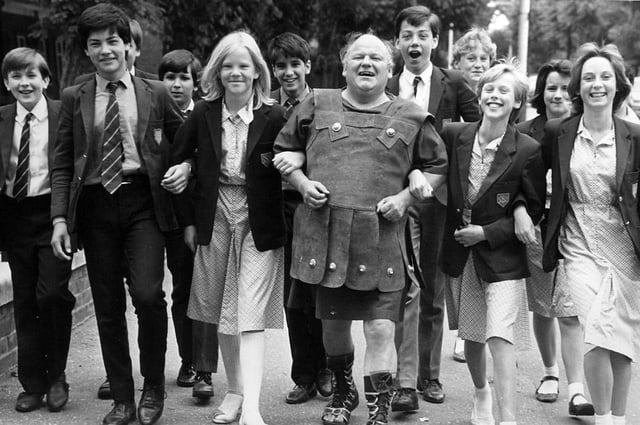 Actor Roy Kinnear dressed as a Roman promoting Peterborough with King's School students.