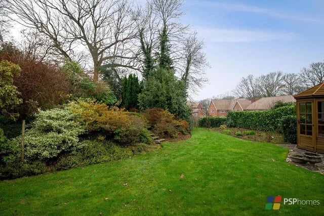 The rear garden enjoys a favoured westerly aspect and there is a paved terrace, expanse of lawn and established borders and beds. Picture: PSP Homes.