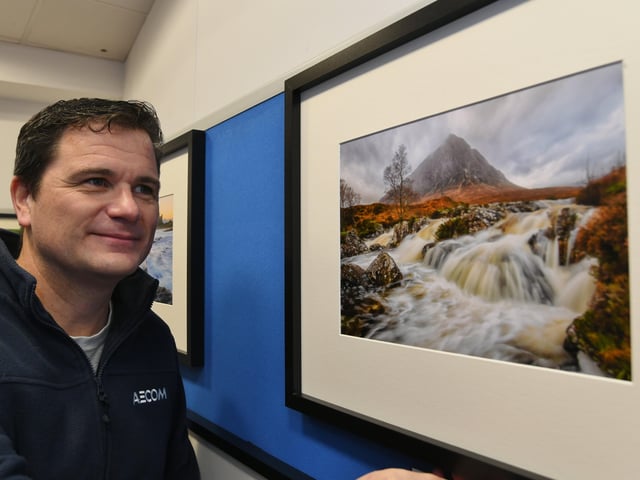 Peterborough Photographic Imaging Co-operative photographic exhibition at Westgate Arcade. Exhibitor Paul Giles with his work. EMN-220122-165239009
