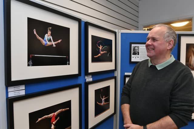 Peterborough Photographic Imaging Co-operative photographic exhibition at Westgate Arcade. Exhibitor Andy Gutteridge with his work. EMN-220122-165228009