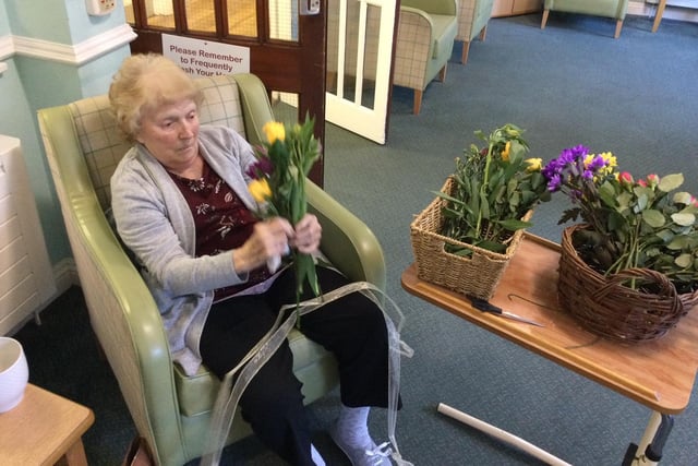 Residents embraced flower day by making flower arrangements with fresh flowers