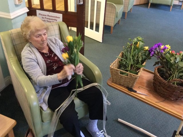 Residents embraced flower day by making flower arrangements with fresh flowers