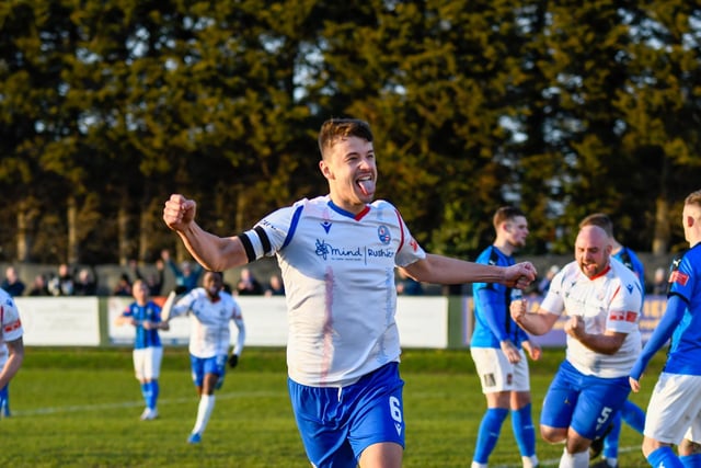 Alex Collard heads off to celebrate after his goal