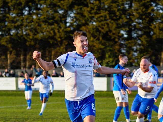 Alex Collard heads off to celebrate after his goal