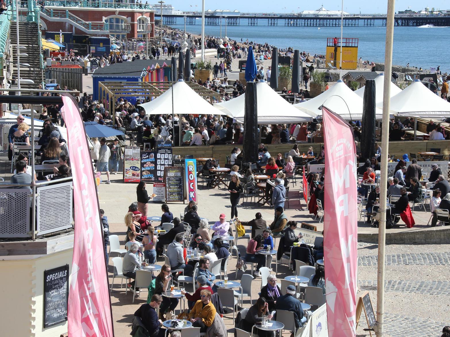 People enjoying drinks by the beach in the sun. Photo: Eddie Mitchell