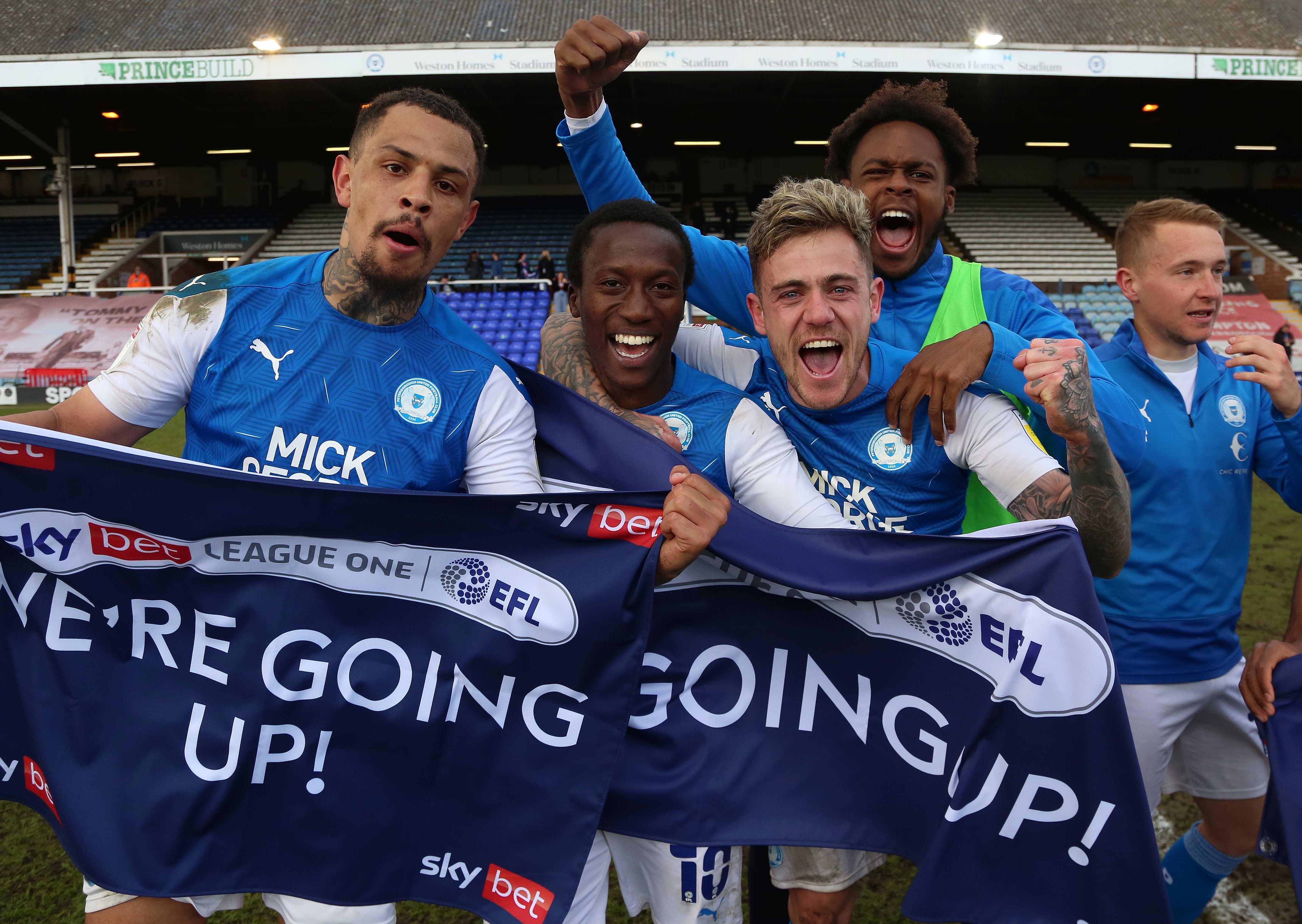 Posh player, from left, Jonson Clarke-Harris, Siriki Dembele, Sammie Szmodics, Ricky-Jade Jones and Louis Reed celebrate promotion.