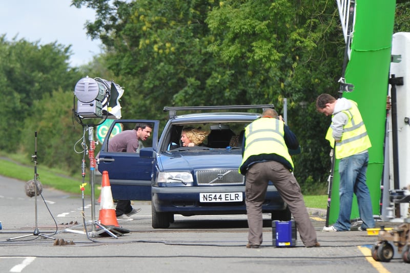 EastEnders' Janine Butcher ( Charlie Brooks) and Ryan Malloy (Neil McDermott) filming a scene where their car is stuck on a railway crossing at Wansford.