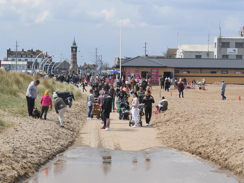 Rain can't stop visitors heading to beach in Skegness over May bank holiday weekend. ANL-210405-134112001