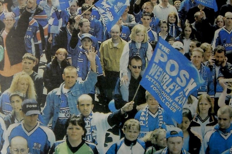 Fans celebrating at the open top bus parade after Posh's Wembley win in 2000.