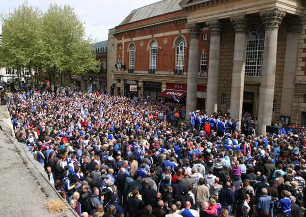 Peterborough United fans celebrate in 2009.