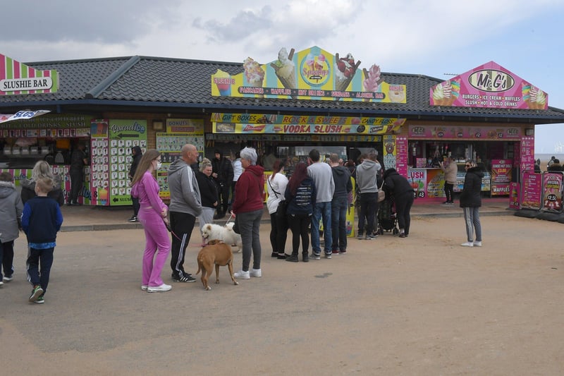 Visitors queue for refreshments at kiosks in Skegness over May bank holiday weekend. ANL-210405-134050001