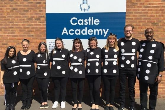 Staff at Castle Academy turned themselves into human dominoes for the day
