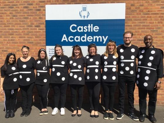 Staff at Castle Academy turned themselves into human dominoes for the day