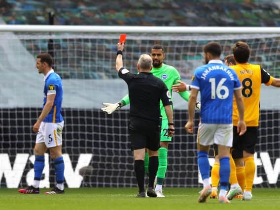 Lewis Dunk received a red card during the second half at Wolves