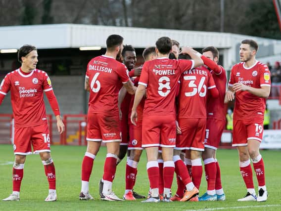 Crawley Town players celebrate a goal against Barrow