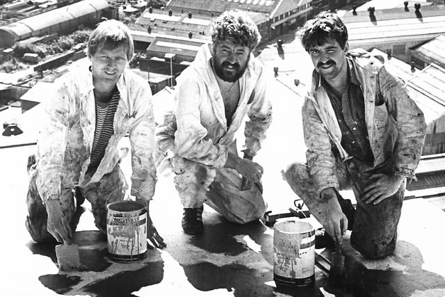 Three workmen hard at work on the Harland and Wolff cranes in July 1983. The City Hospital and Churchill House can clearly be seen from this breathtaking photograph over Belfast. What a view! Picture: News Letter archives