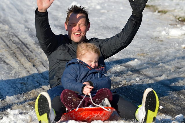 Having fun on a snow covered Brooke Park on Saturday afternoon last. Photo: George Sweeney / Derry Journal.  DER2104GS – 023