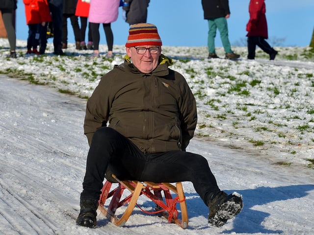 John McHugh sliding in a snow covered Brooke Park on Saturday afternoon last. Photo: George Sweeney / Derry Journal. DER2104GS – 025