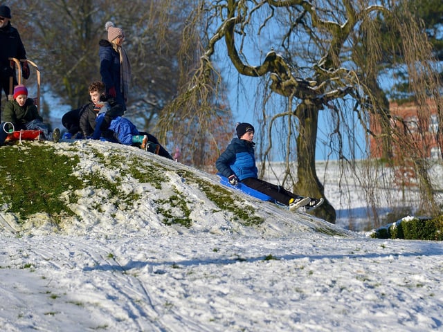 Having fun in the snow in a picturesque Brooke Park on Saturday afternoon last. Photo: George Sweeney / Derry Journal. DER2104GS – 030
