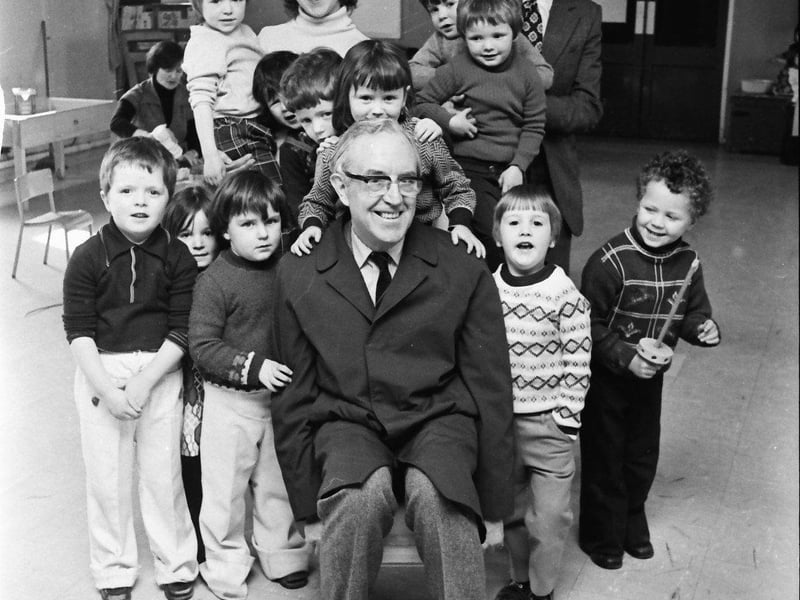 Air Commodore WN Hibbert, Director General, Save the Children Fund, pictured when he visited the Fund's playgroup at Shantallow Community Centre. Also in picture are Colette Deeney, playgroup leader, and CJ Hunt, Save the Children Fund NI Council.