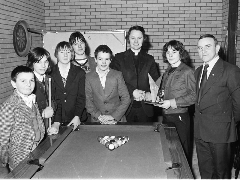 Rev. Paddy O'Kane presents the St Eugene's Youth Association pool competition trophy to Michael McCafferty, captain, Abbeyville, winners of the competition. Included, from left, are team members, Hugh Donnelly, Paddy Holden, Ray Ramsey, Gerard Sheerin, Brendan Meenan and Jackie McCauley, club leader.