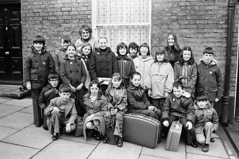 Group of schoolchildren from Derry pictured before leaving the city for a holiday in Taunton, Somerset, organised by Holiday Projects, Derry. At back are escorts, Majella Flood (left) and Yvonne Coyle.