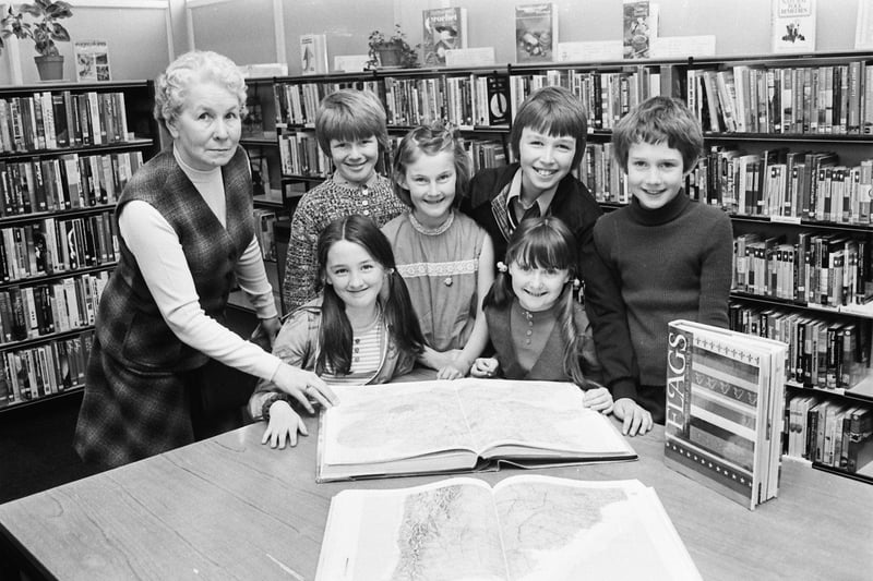 Children from Carnhill PS using reference books at the library. At front, Deirdre Harley (left) and Noelle Mottram. At back, from left, Anna Peoples, library assistant in charge, Ciaran O'Donnell, Christine Hurford, Richard Boyle and Bernard Hasson.