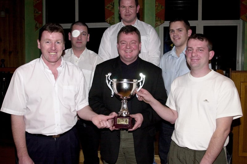 Gary Fleming, centre, presents Eamon McGlinchey, left and Charlie Casey with the Doherty-Fleming Memorial Snooker Trophy. Also included are Alex McLaughlin (referee) with Cyril Ming runners-up.