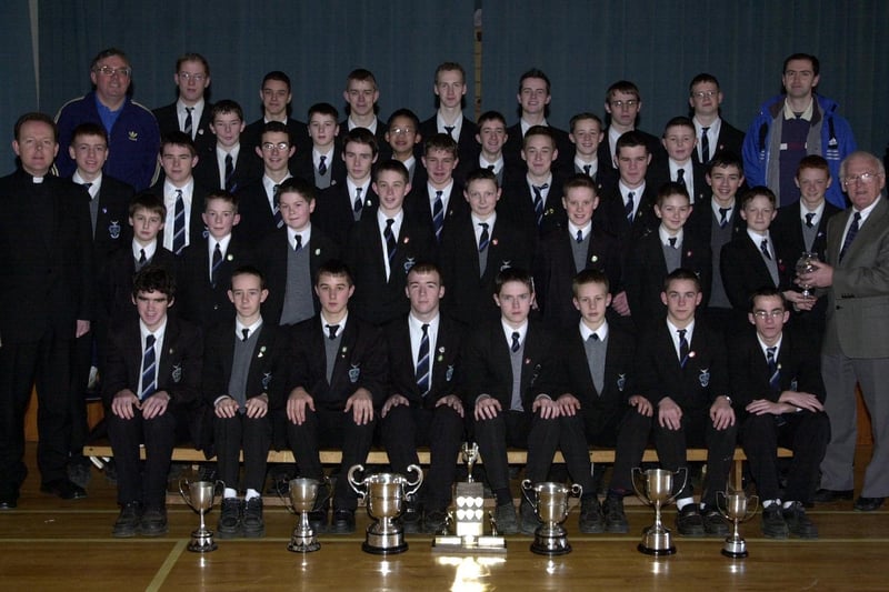 Mr Andy McClea pictured with members of the St Columb's College cross country teams, winners of the Minor, Junior, Intermediate and Senior titles at the District  Championships