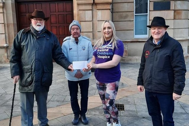 Caring Caretaker Davy Boyle presents Kirsty Doherty of the Children's Hospice with a cheque for  £2,000. Also included are Davy's friends and supporters Maurice Greer and Curtis Magee