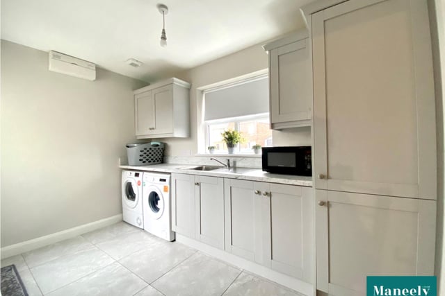 The utility area has grey high and low level units and is plumbed for an automatic washing machine and has space for a tumble dryer.
